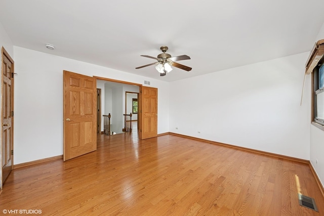 600 N Brookdale Dr, Schaumburg, IL 60194 - unfurnished bedroom featuring light wood-style floors and ceiling fan