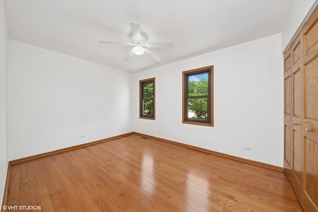600 N Brookdale Dr, Schaumburg, IL 60194 - unfurnished bedroom with light wood-type flooring, a ceiling fan, and a closet