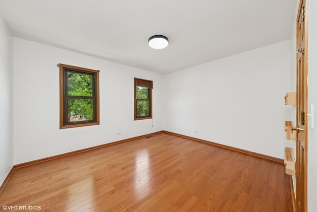 600 N Brookdale Dr, Schaumburg, IL 60194 - spare room featuring light wood finished floors