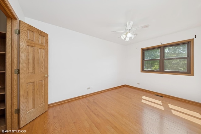 600 N Brookdale Dr, Schaumburg, IL 60194 - spare room with light wood-style floors and ceiling fan