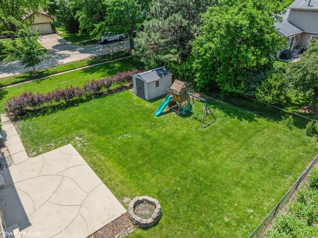 600 N Brookdale Dr, Schaumburg, IL 60194 - view of green lawn with a playground and a shed