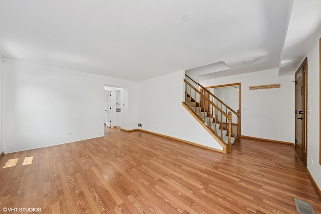 600 N Brookdale Dr, Schaumburg, IL 60194 - unfurnished living room featuring light wood finished floors and stairway