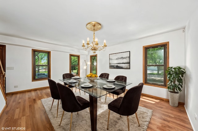 600 N Brookdale Dr, Schaumburg, IL 60194 - dining room featuring light wood finished floors, healthy amount of natural light, and a chandelier