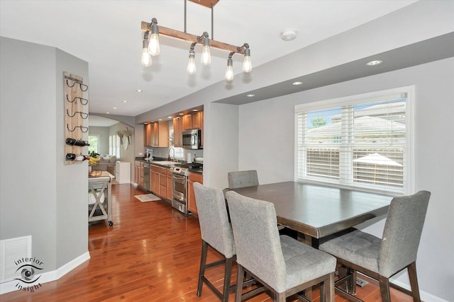 16838 S 91st Ave, Orland Hills, IL 60487 - dining area featuring dark wood finished floors, recessed lighting, and arched walkways