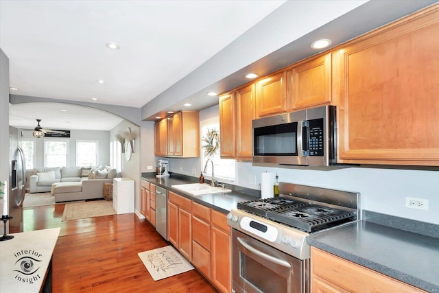 16838 S 91st Ave, Orland Hills, IL 60487 - kitchen featuring stainless steel appliances, recessed lighting, arched walkways, open floor plan, and a ceiling fan