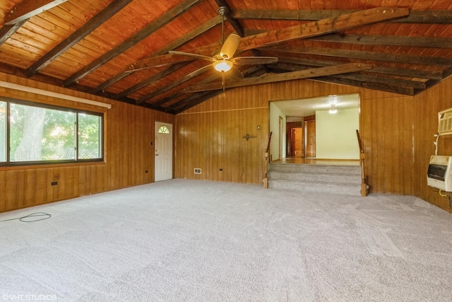 509 Sherman Ave, Aurora, IL 60505 - unfurnished room with heating unit, wood walls, carpet flooring, and a ceiling fan