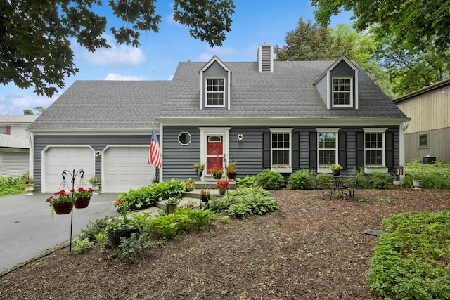 5618 Marietta Dr, Crystal Lake, IL 60014 - cape cod house featuring driveway, a garage, a chimney, and a shingled roof