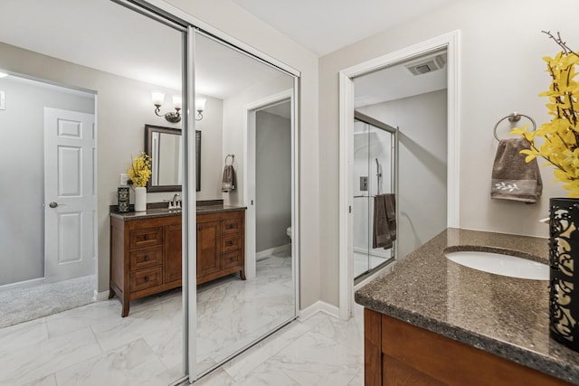 5618 Marietta Dr, Crystal Lake, IL 60014 - full bath with marble look tiles, two vanities, and a stall shower