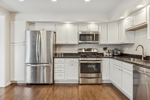 5618 Marietta Dr, Crystal Lake, IL 60014 - kitchen with stainless steel appliances, white cabinetry, dark countertops, and recessed lighting