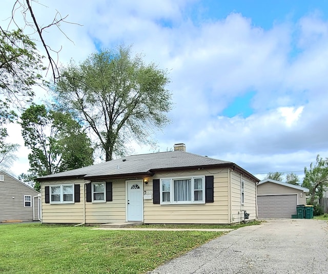 2305 Marmion Ave, Joliet, IL 60436 - view of front of property with an outdoor structure, a chimney, a front yard, and a garage