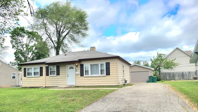 2305 Marmion Ave, Joliet, IL 60436 - bungalow-style house with an outdoor structure, a garage, and a chimney