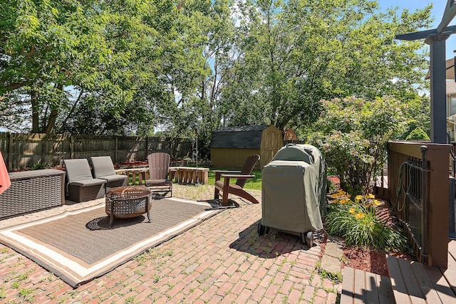 24929 Vermette Rd, Plainfield, IL 60585 - view of patio featuring a fire pit and a storage shed