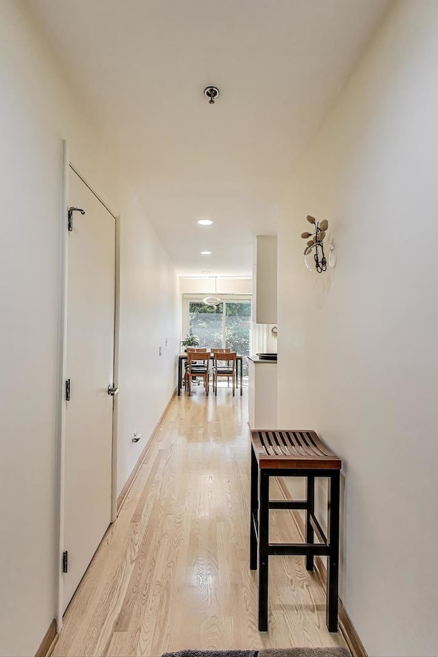 351 Kelburn Rd Unit 112, Deerfield, IL 60015 - hallway with light wood-type flooring and baseboards