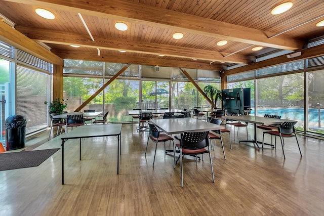 351 Kelburn Rd Unit 112, Deerfield, IL 60015 - playroom featuring wood finished floors, a wooden ceiling with exposed beams, and a wall of windows