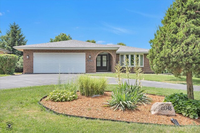13348 S Stephen Dr, Palos Park, IL 60464 - single story home with concrete driveway, an attached garage, brick siding, and a front lawn