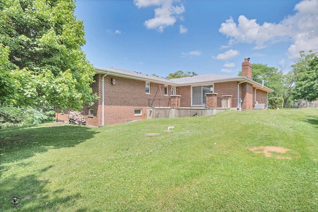 13348 S Stephen Dr, Palos Park, IL 60464 - rear view of house featuring a chimney, brick siding, and a yard