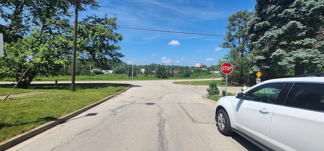 504 W Avery St, Elmhurst, IL 60126 - view of asphalt road with traffic signs and curbs