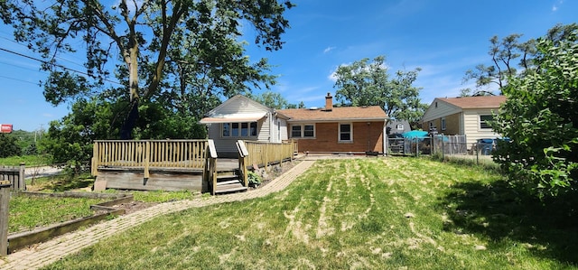 504 W Avery St, Elmhurst, IL 60126 - back of house featuring a wooden deck, a fenced backyard, a chimney, and brick siding