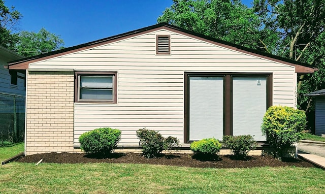 16536 Wolcott Ave, Markham, IL 60428 - view of property exterior with a yard and brick siding