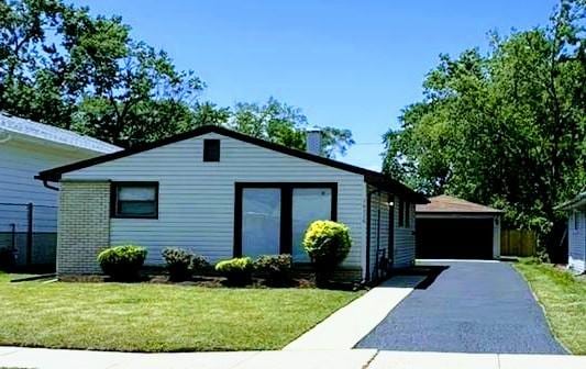 16536 Wolcott Ave, Markham, IL 60428 - ranch-style home with a garage, a front lawn, and an outdoor structure