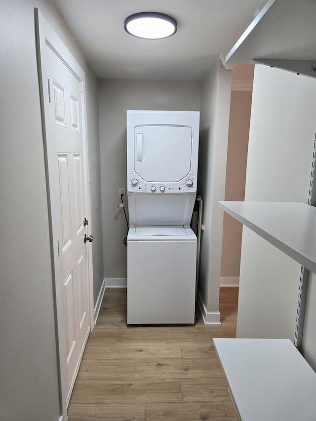 16536 Wolcott Ave, Markham, IL 60428 - laundry room with estacked washer and dryer and light wood-style floors