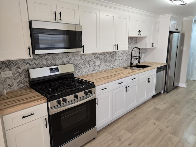 16536 Wolcott Ave, Markham, IL 60428 - kitchen with appliances with stainless steel finishes, wood counters, and decorative backsplash