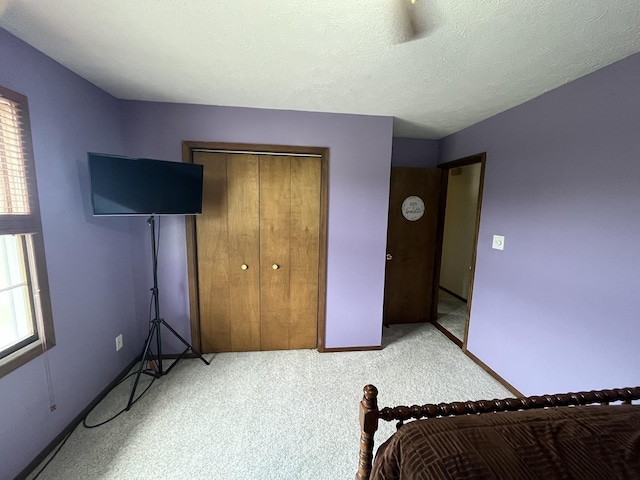 18367 US-150 Hwy, Bloomington, IL 61705 - carpeted bedroom with a closet and baseboards