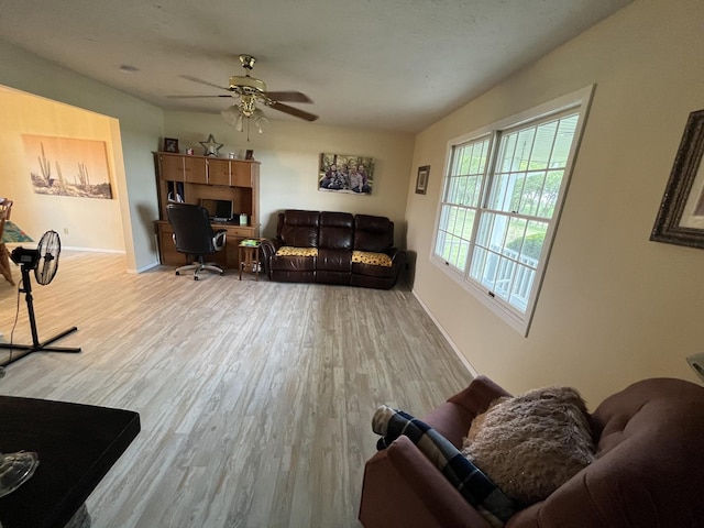 18367 US-150 Hwy, Bloomington, IL 61705 - living area featuring wood finished floors, ceiling fan, and a desk