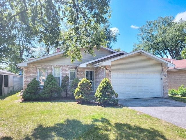 14326 Irving Ave, Dolton, IL 60419 - view of front of property with driveway, an attached garage, a front lawn, and brick siding