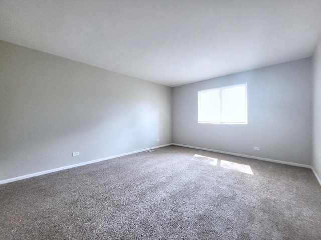 14326 Irving Ave, Dolton, IL 60419 - carpeted spare room with baseboards