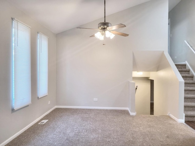 14326 Irving Ave, Dolton, IL 60419 - unfurnished living room featuring carpet floors, a ceiling fan, vaulted ceiling, and stairs