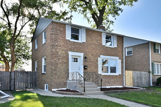 2024 S 24th Ave, Broadview, IL 60155 - view of front facade featuring brick siding and a chimney