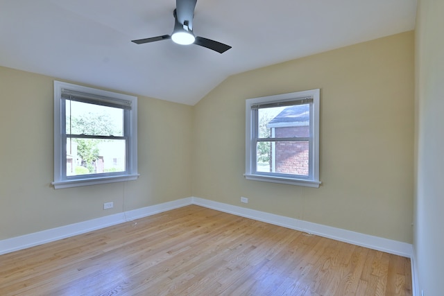 2024 S 24th Ave, Broadview, IL 60155 - unfurnished room featuring plenty of natural light, light wood-style flooring, vaulted ceiling, and a ceiling fan