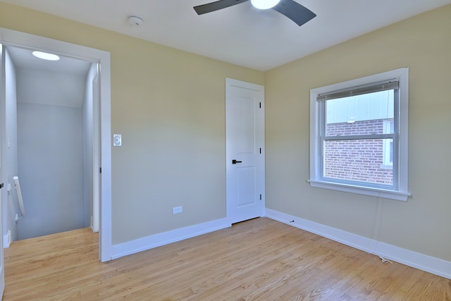 2024 S 24th Ave, Broadview, IL 60155 - unfurnished bedroom with light wood-type flooring and ceiling fan
