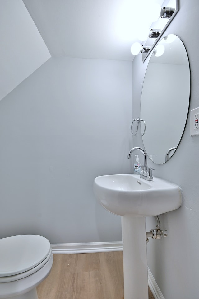 2024 S 24th Ave, Broadview, IL 60155 - bathroom with wood finished floors and toilet