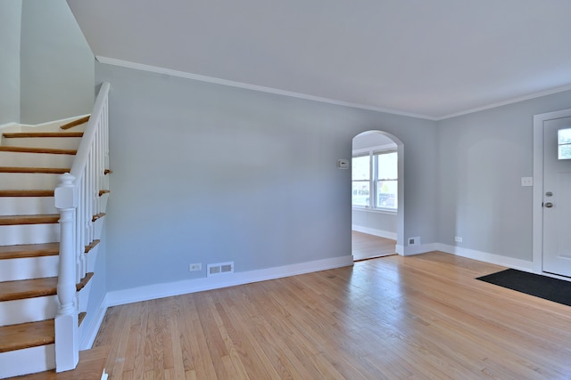 2024 S 24th Ave, Broadview, IL 60155 - entrance foyer with arched walkways, light wood-style floors, crown molding, and stairway