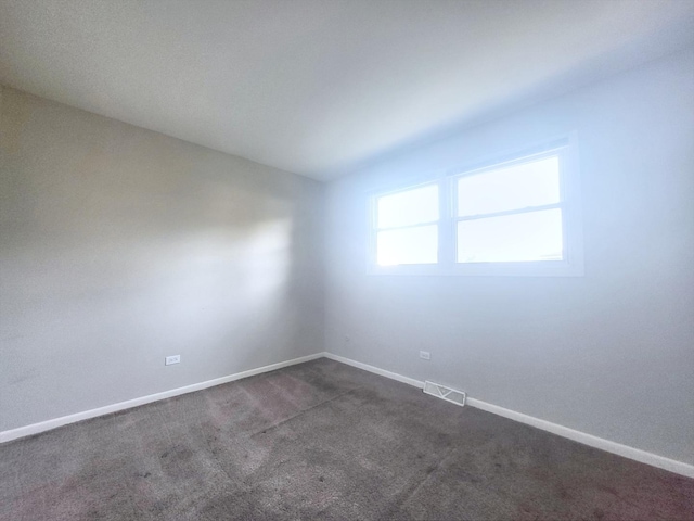 6037 Spring Ln, Matteson, IL 60443 - unfurnished room with dark carpet and baseboards