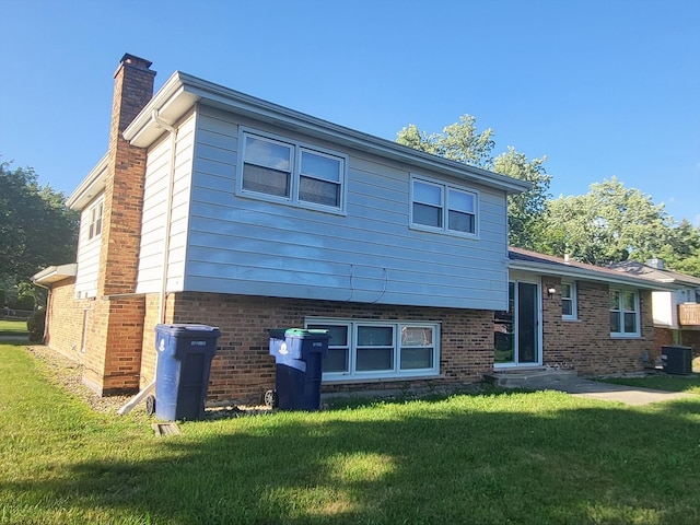 6037 Spring Ln, Matteson, IL 60443 - view of front of property featuring a chimney, a front yard, and brick siding
