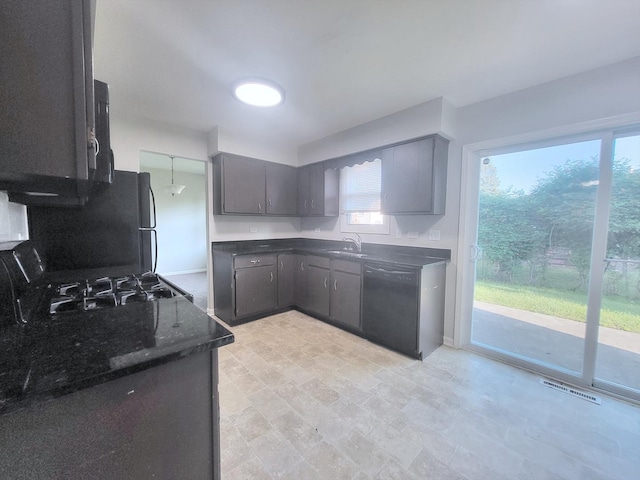 6037 Spring Ln, Matteson, IL 60443 - kitchen featuring dishwasher, dark stone countertops, and range