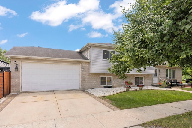 14301 S California Ave, Posen, IL 60469 - split level home with brick siding, a front yard, a garage, and driveway