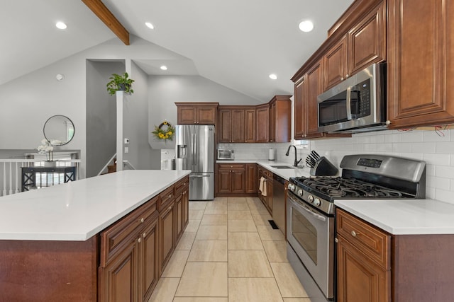 14301 S California Ave, Posen, IL 60469 - kitchen with appliances with stainless steel finishes, decorative backsplash, a kitchen island, light countertops, and recessed lighting