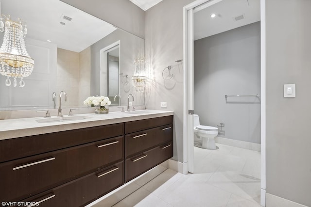 118 E Erie St Unit 19C, Chicago, IL 60611 - full bathroom featuring a chandelier, double vanity, and tile patterned flooring