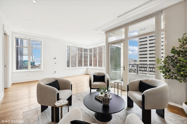 118 E Erie St Unit 19C, Chicago, IL 60611 - living area with wood finished floors, ornamental molding, and recessed lighting
