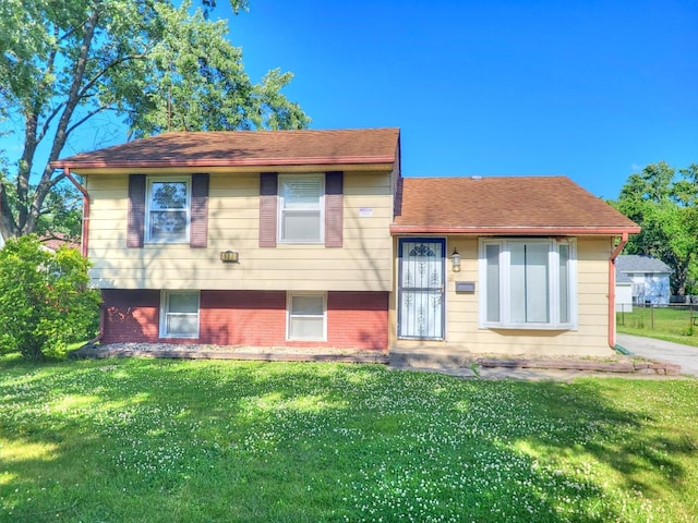 127 N Cedar Ln, Glenwood, IL 60425 - tri-level home with a front lawn and brick siding