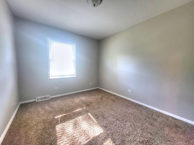 127 N Cedar Ln, Glenwood, IL 60425 - carpeted spare room with baseboards