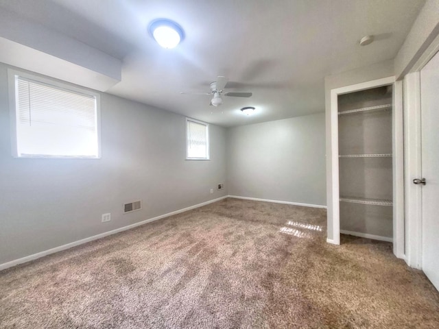 127 N Cedar Ln, Glenwood, IL 60425 - unfurnished bedroom featuring carpet floors, a closet, and ceiling fan