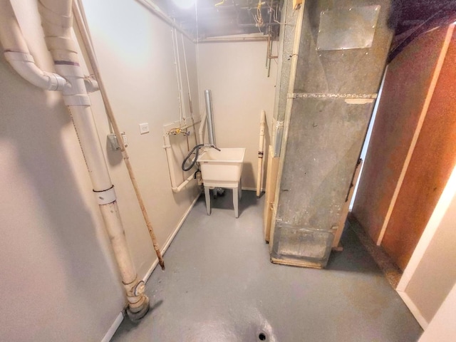 127 N Cedar Ln, Glenwood, IL 60425 - unfinished basement featuring baseboards and a sink