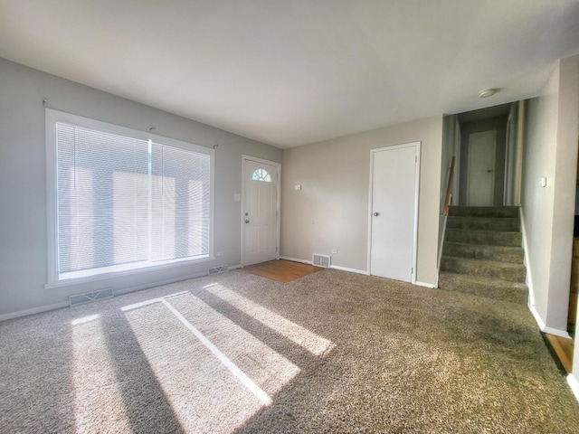 127 N Cedar Ln, Glenwood, IL 60425 - foyer featuring carpet flooring and stairs