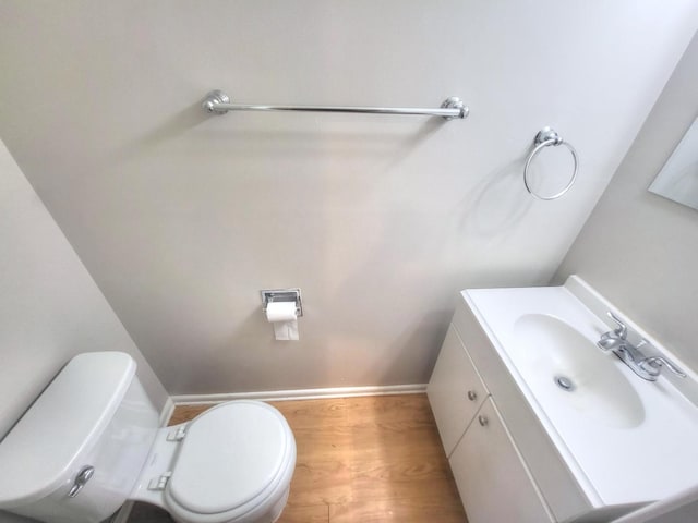 127 N Cedar Ln, Glenwood, IL 60425 - half bathroom with vanity and wood finished floors