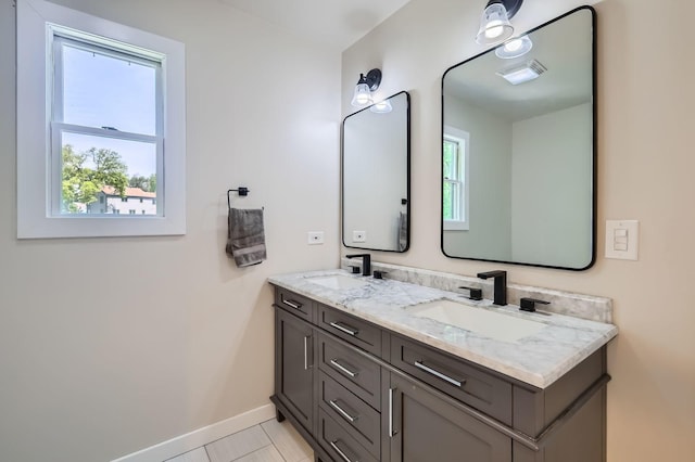 1718 Rosewood Ln, Johnsburg, IL 60051 - bathroom featuring double vanity and baseboards
